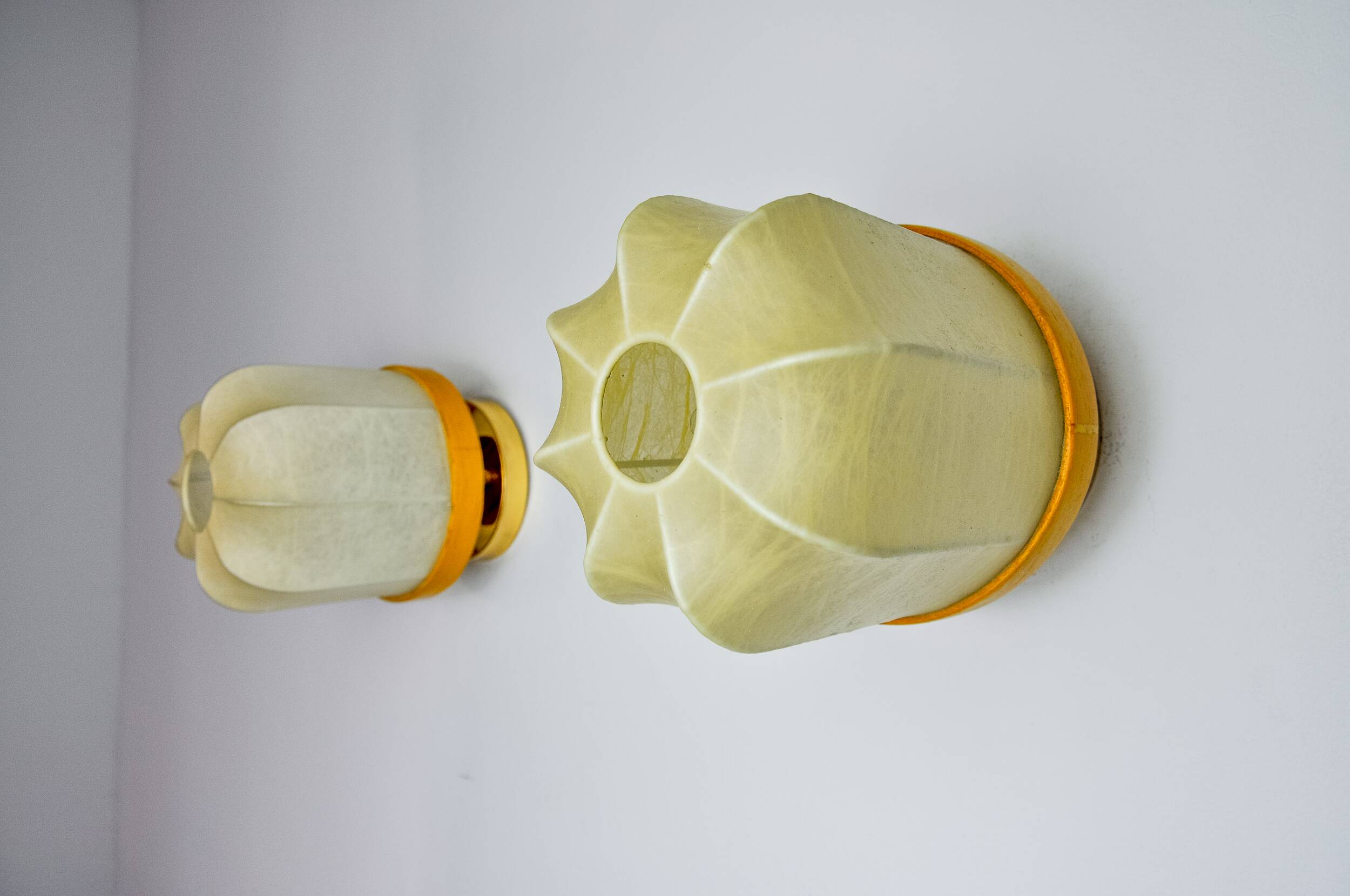 Pair of "cocoon" wall lights, resin and pine, Italy, 1970