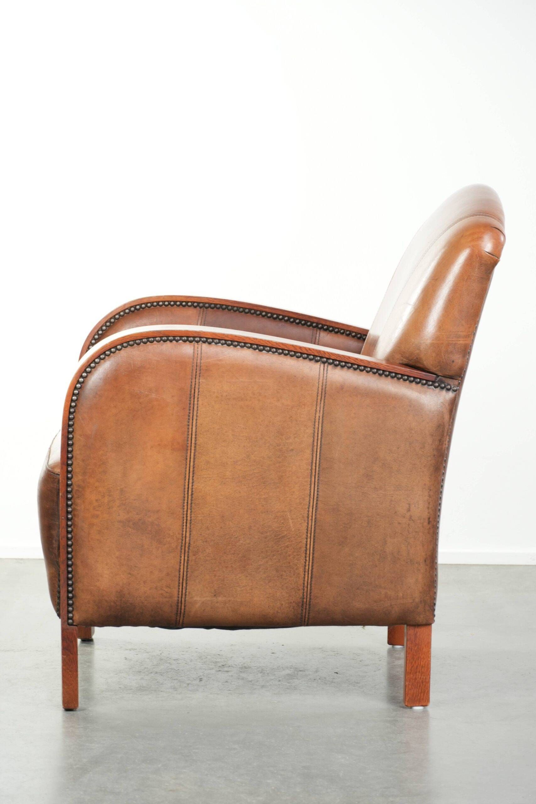Sheepskin armchair in Art Deco style with wooden armrests