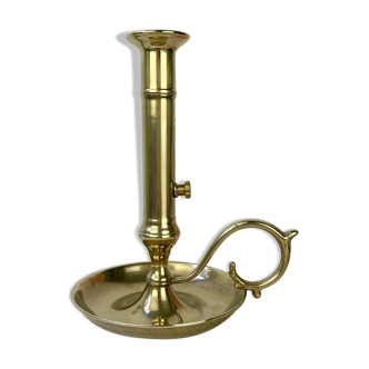 Brass candle holder with pusher late nineteenth century