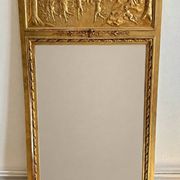 Gilded trumeau in the Louis XVI style with curious decorations.