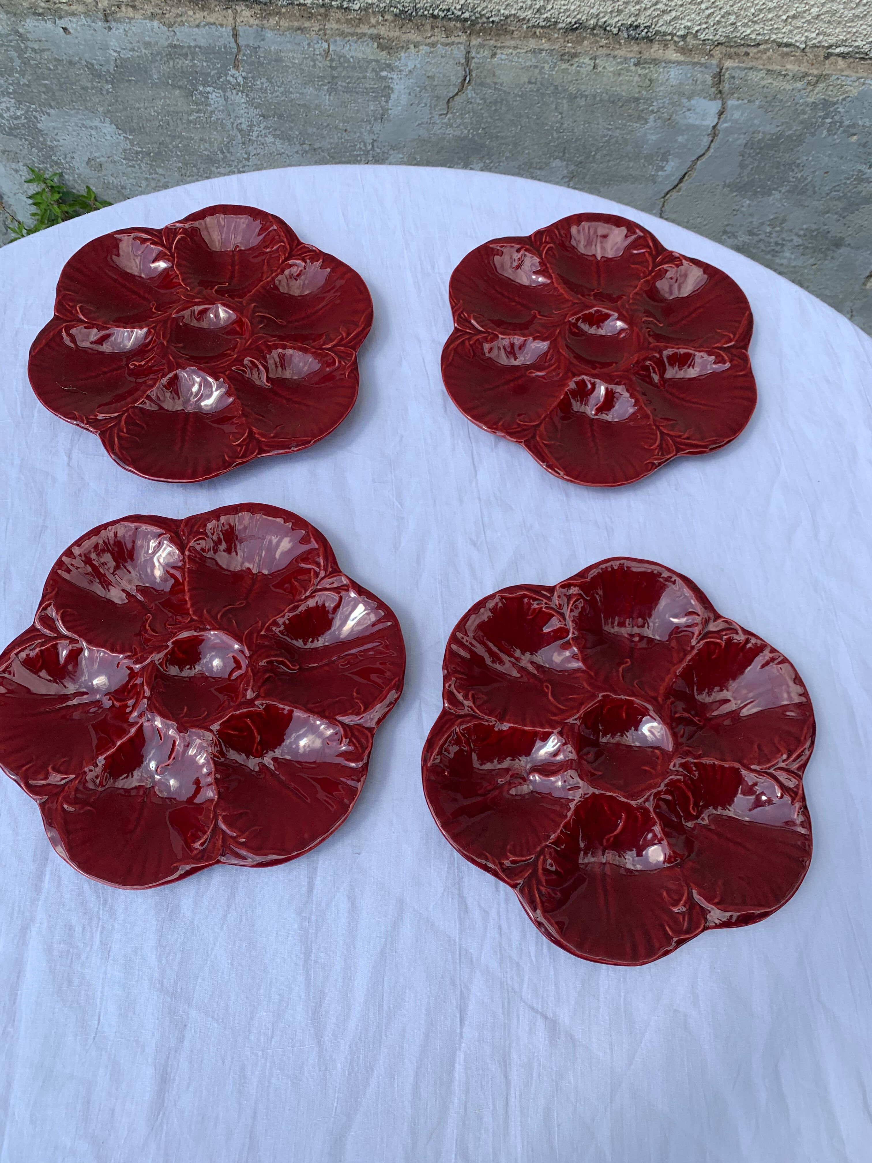 4 oyster plates in vintage red glazed ceramic slip and collector