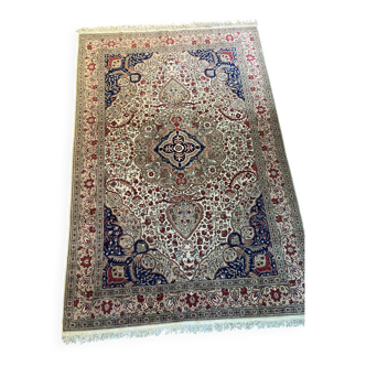 Large hand-knotted wool oriental rug with large central medallion