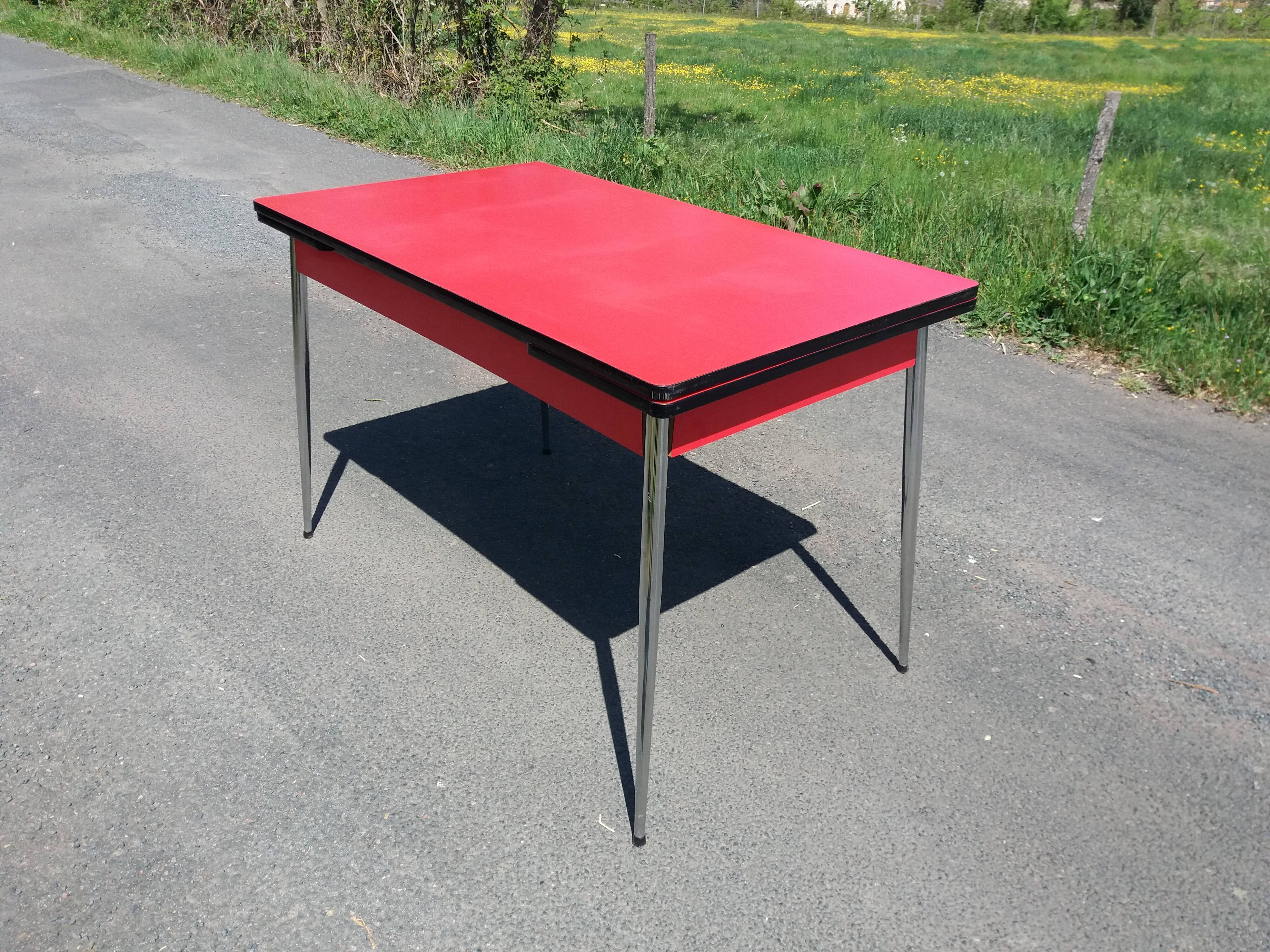 Dining table with red formica extensions