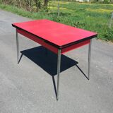 Dining table with red formica extensions