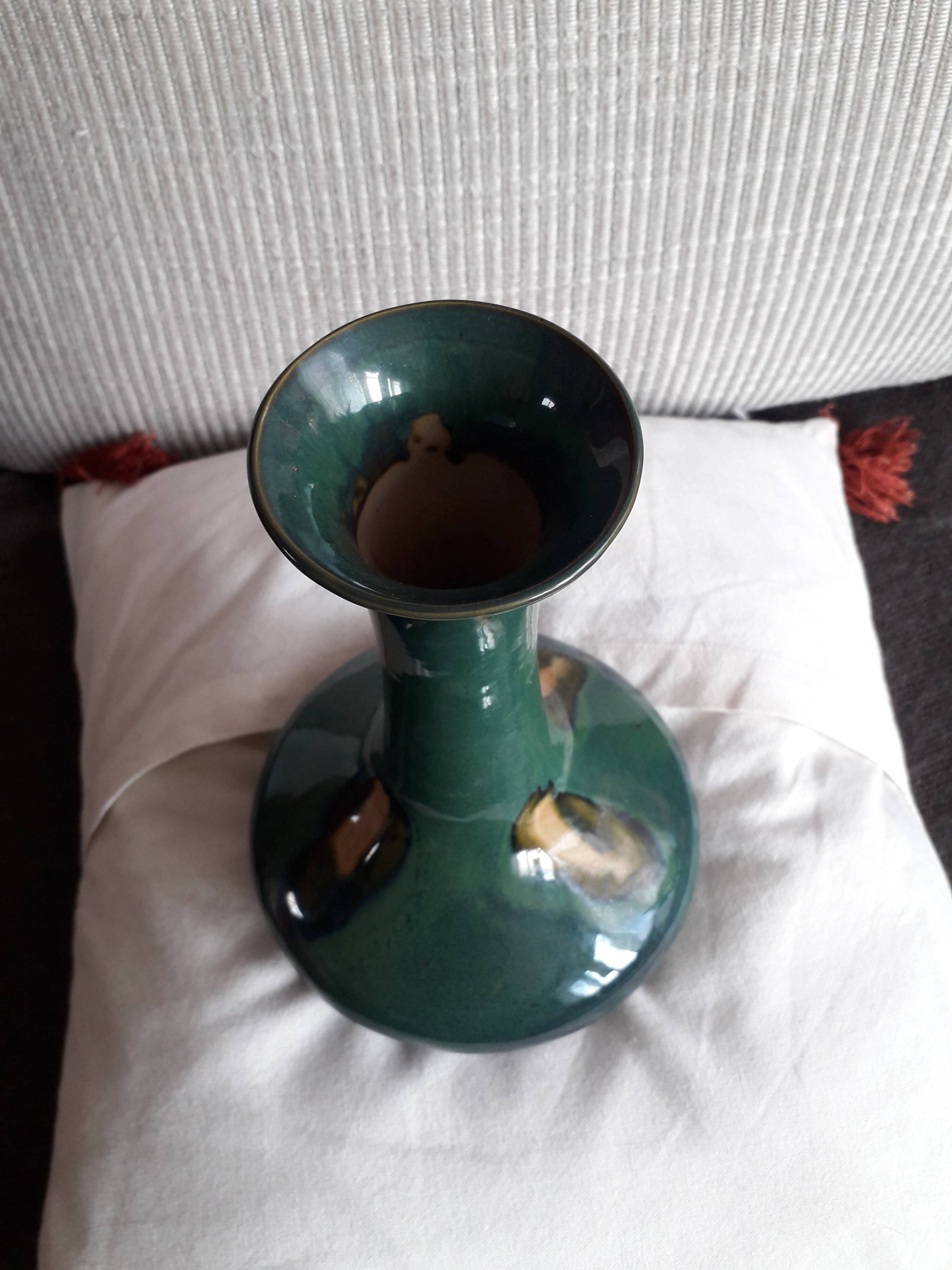 Vintage ceramic vase with a very original design.