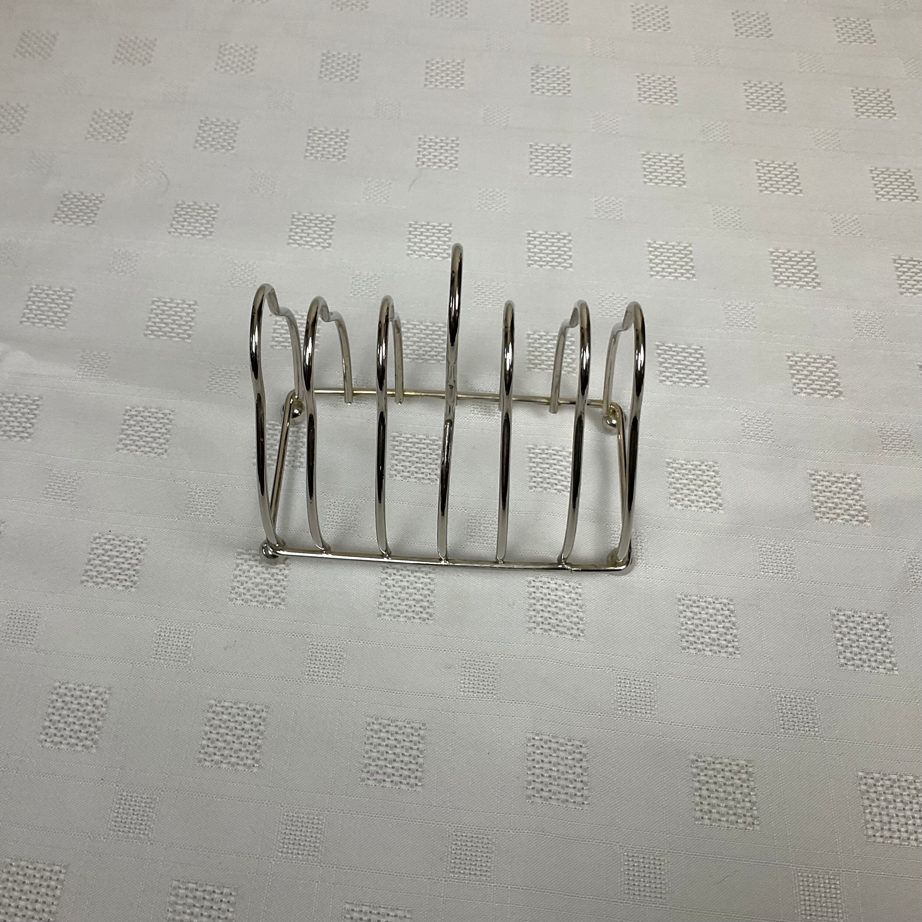 Toast holder in silver metal