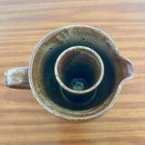 Large antique brown glazed stoneware jug with cork stopper.