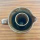 Large antique brown glazed stoneware jug with cork stopper.