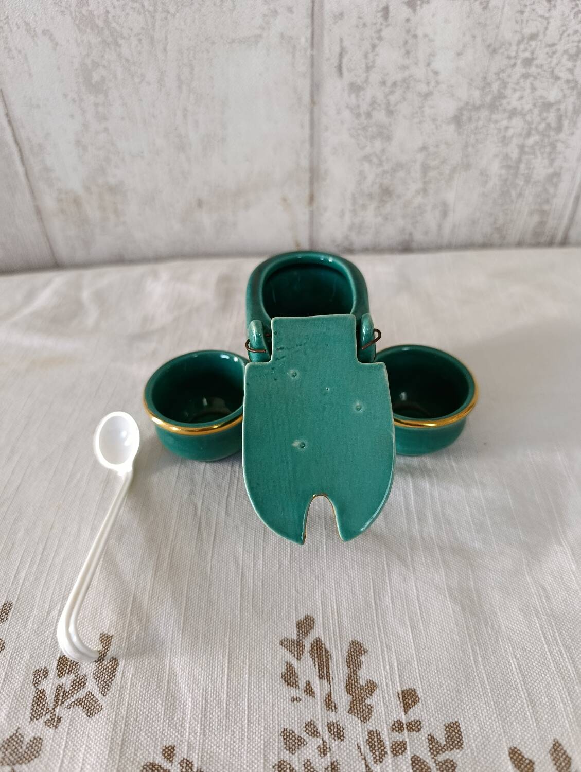 Mustard and salt pepper shaker in the shape of a toilet.
