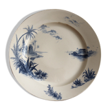 Flat in iron earth "views of the Orient" faience of Gien