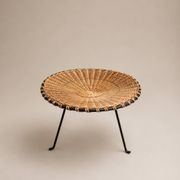 Small vintage tripod stool in woven rattan and black metal, dating from the 1970s.
