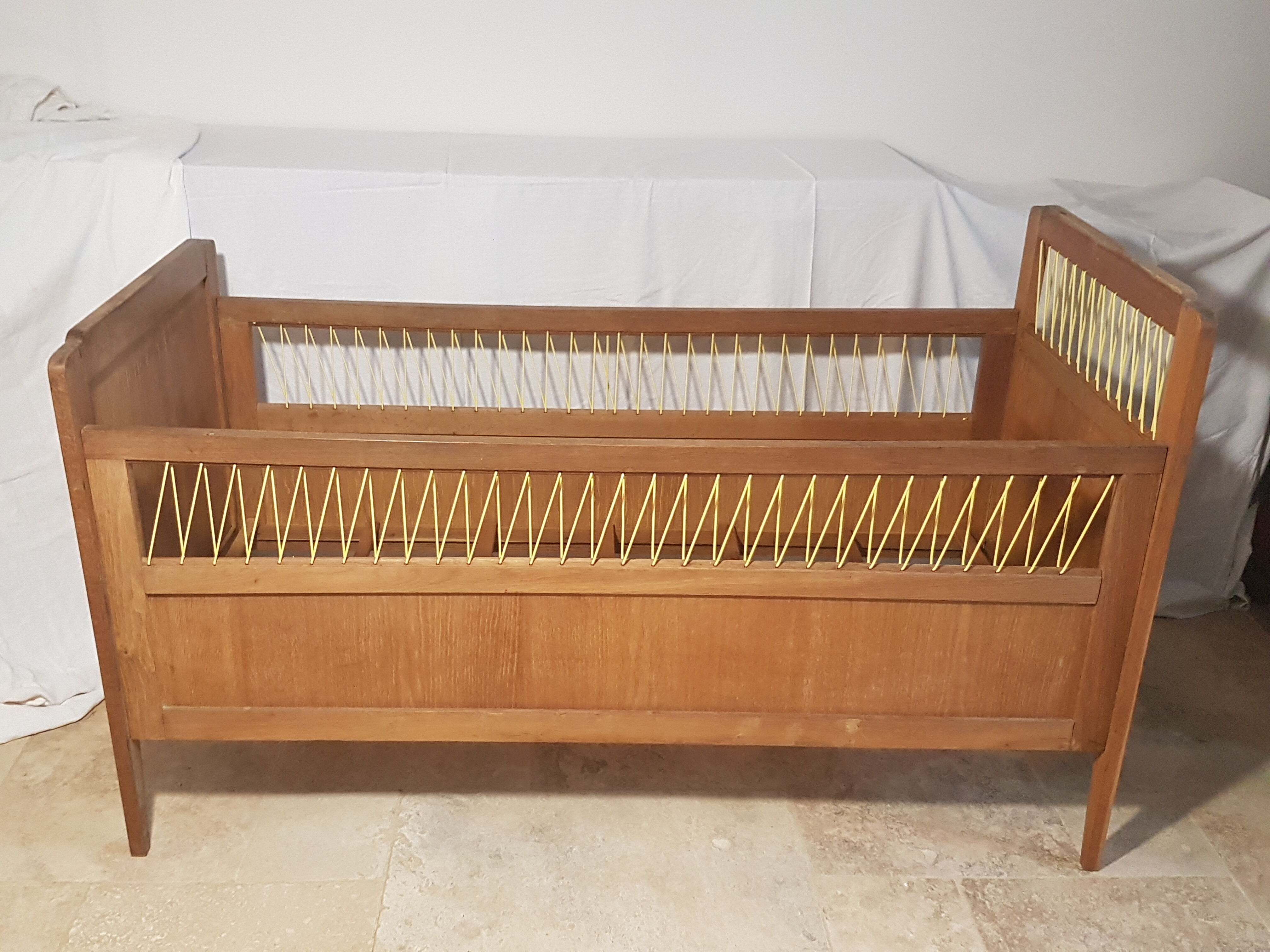Children's bed made of wood and yellow scoubidou, 1950s.