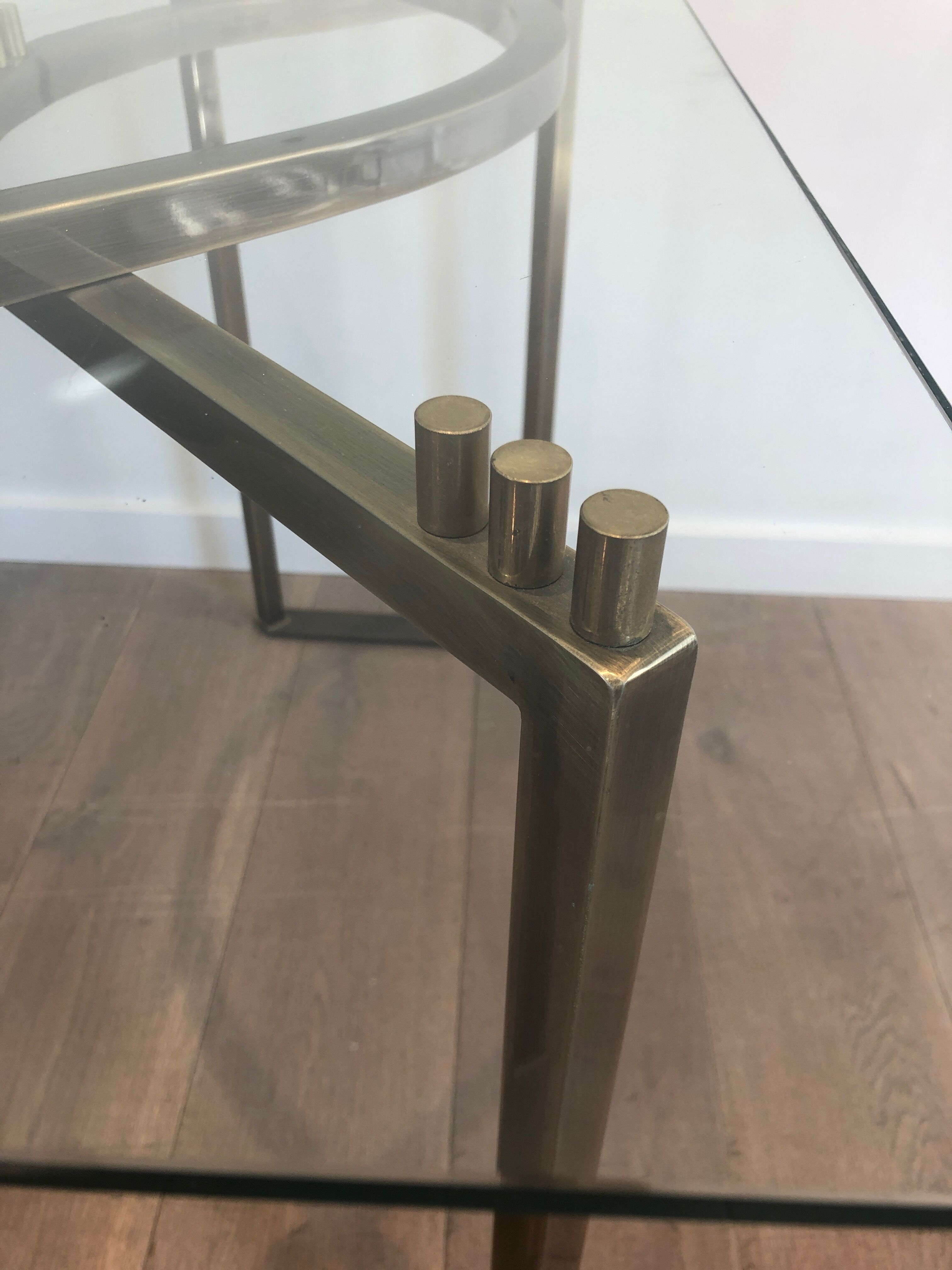 Console in brushed steel and brass and tray formed of a glass slab. French work. Around 1970