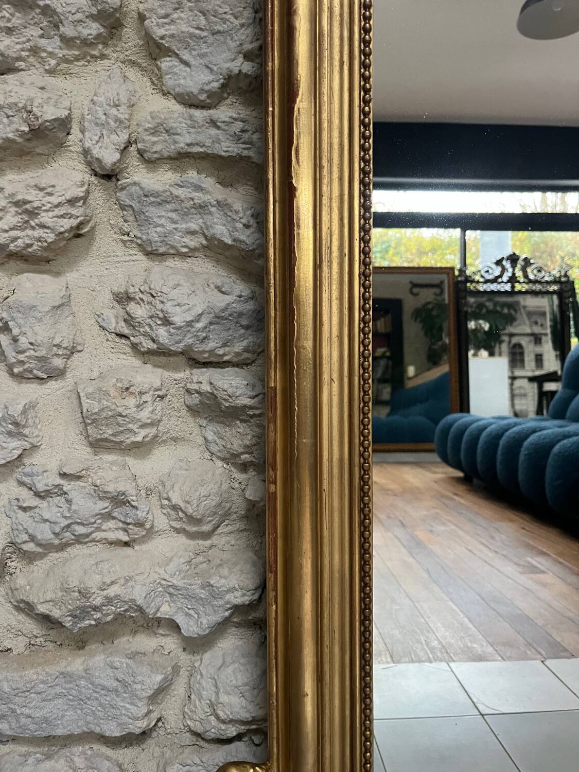 Antique mirror 169/105cm with pediments and pearl detailing in gold leaf.