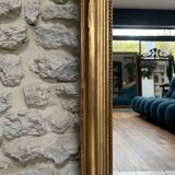 Antique mirror 169/105cm with pediments and pearl detailing in gold leaf.