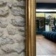 Antique mirror 169/105cm with pediments and pearl detailing in gold leaf.