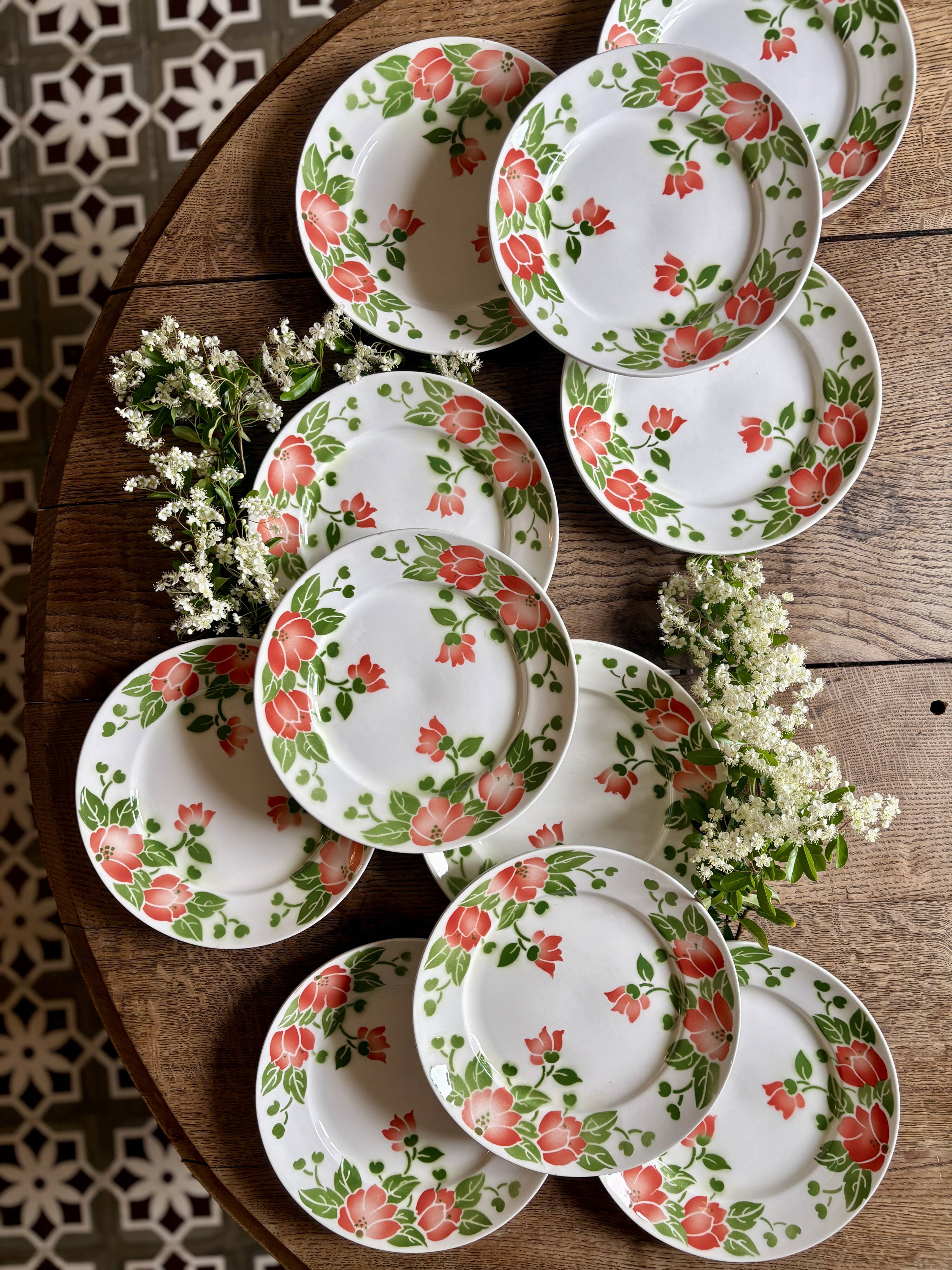 Set of 11 vintage flat plates by Eric de Moulin des Loups.