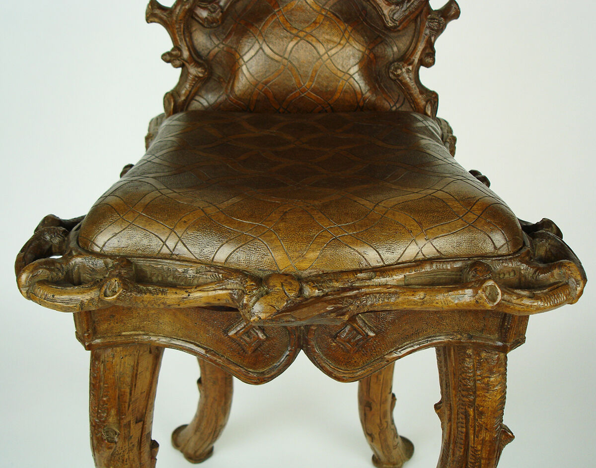 Sculpted chair in "black drill" style