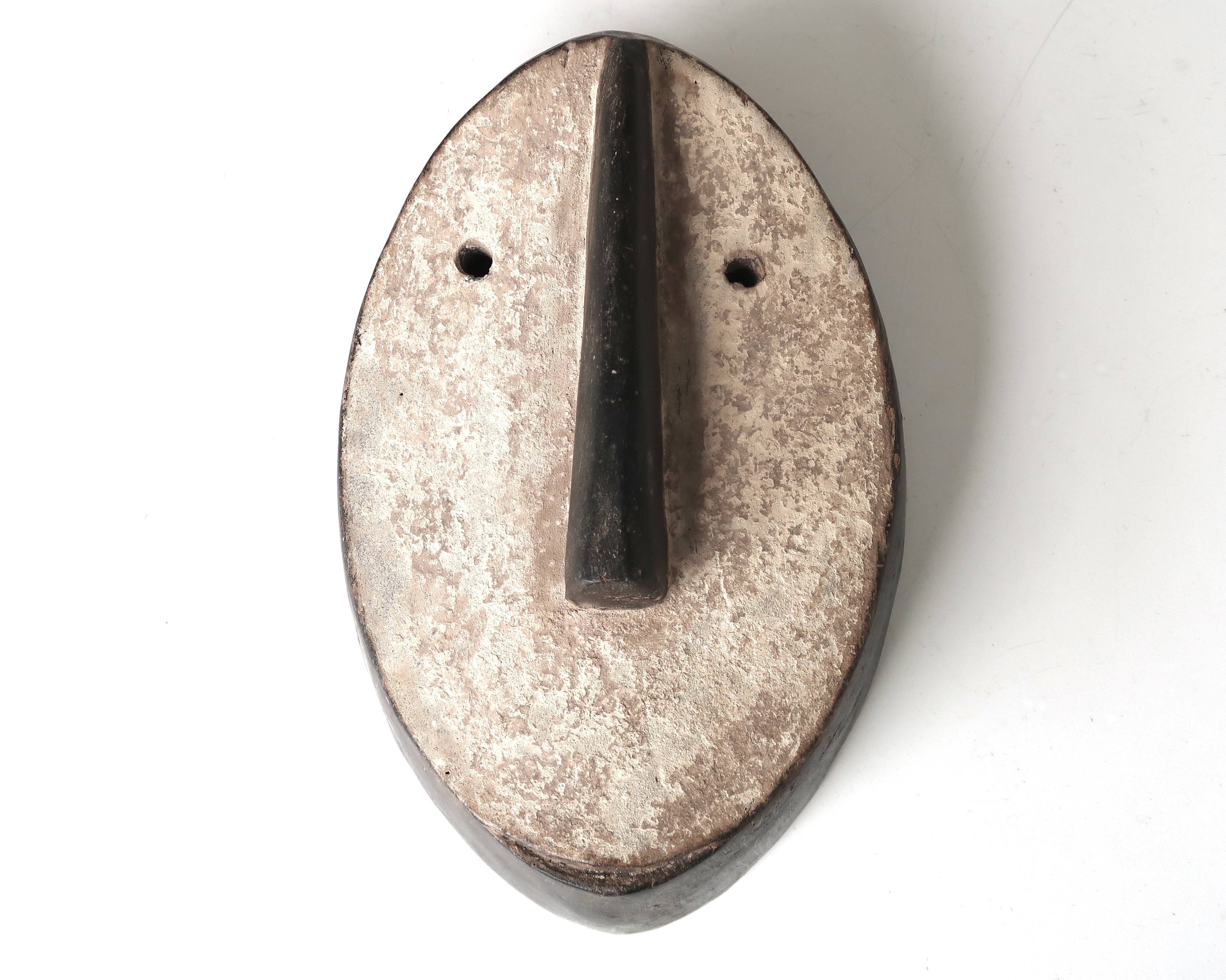 Minimalist wooden African wall mask, vintage Africa