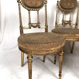 Series of three Louis XVI style chairs in gilded wood, circa 1900