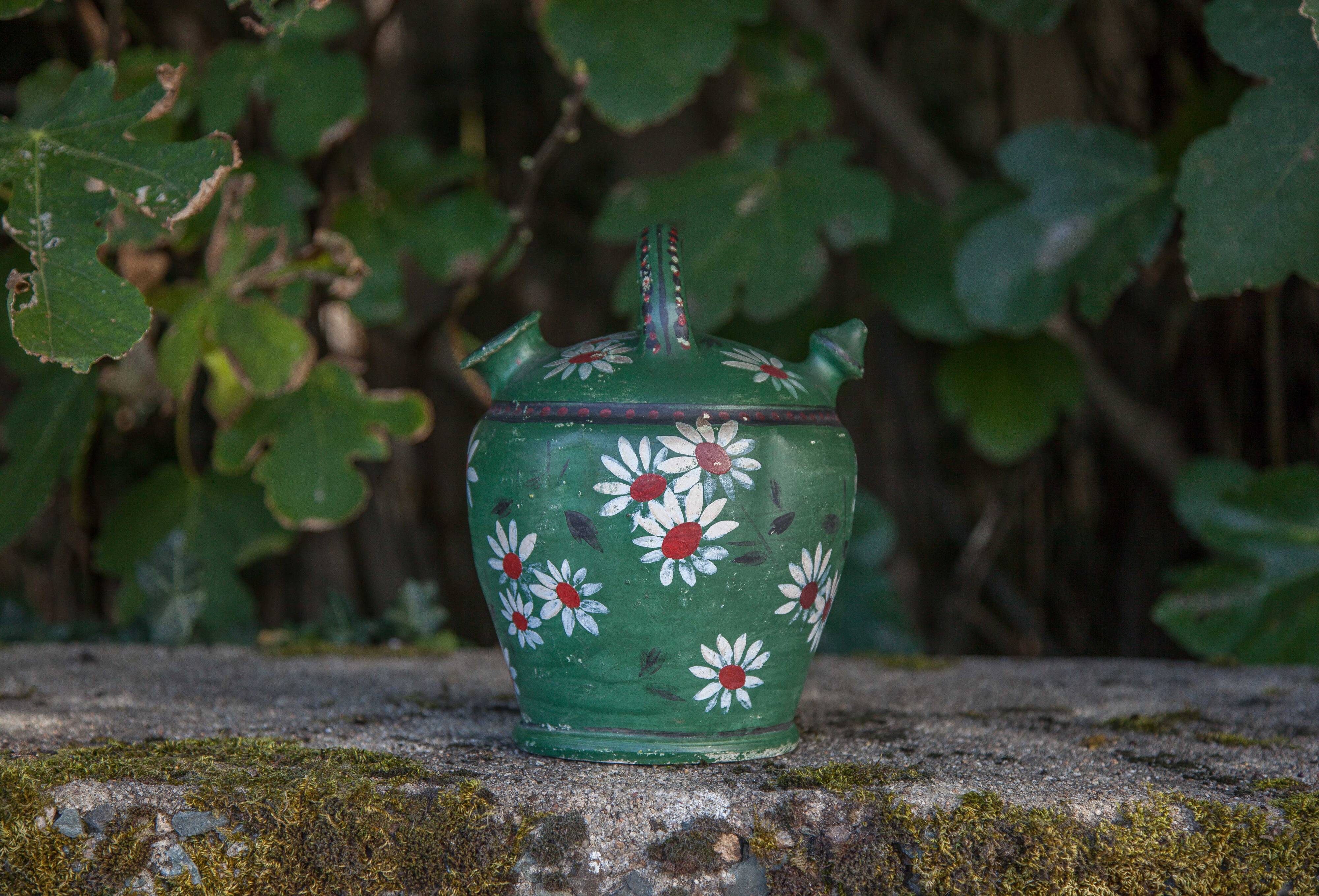 Vintage gargoulette, jug, green painted pitcher with daisy patterns