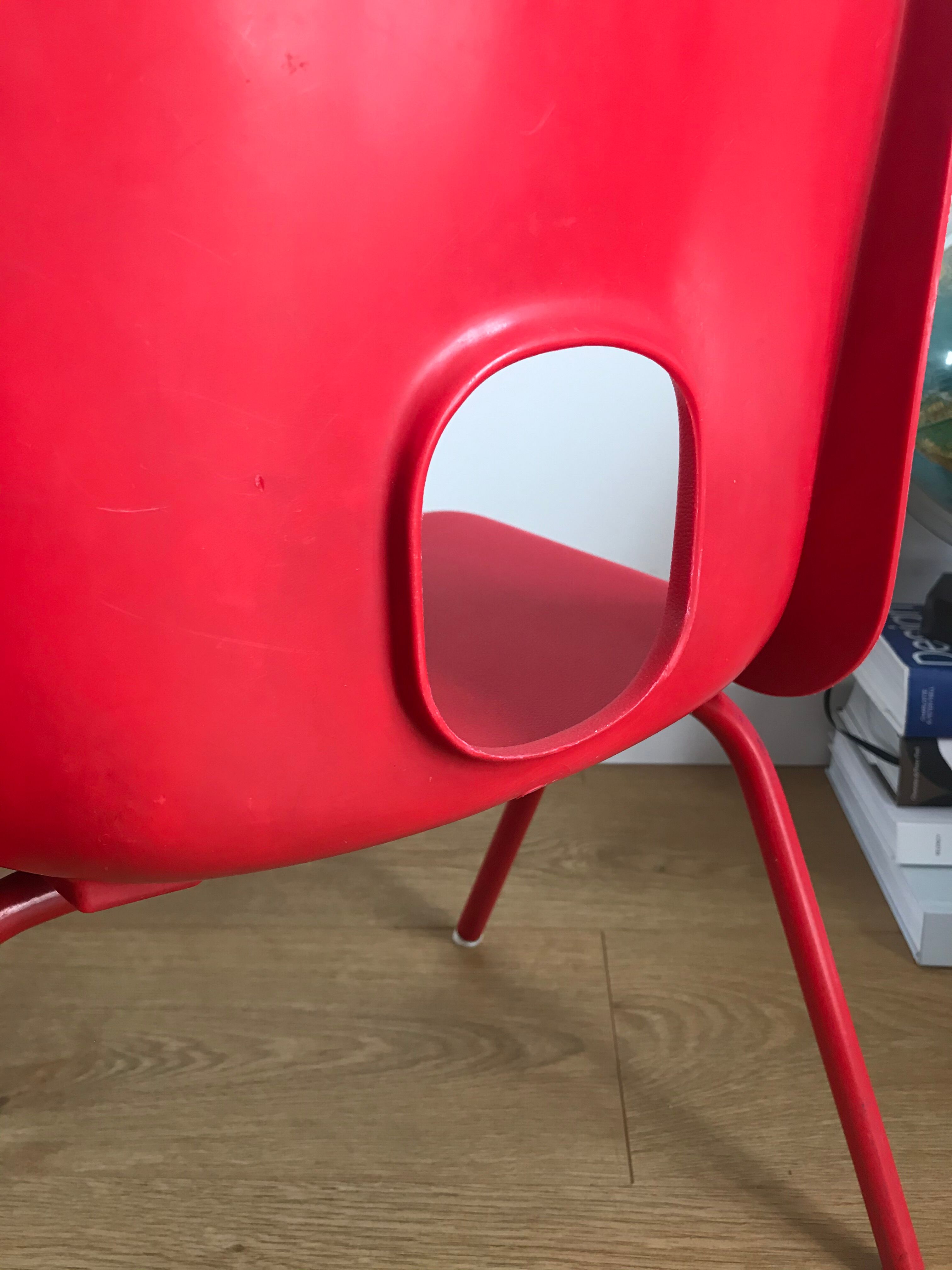 Red child chair by robin day for ikea