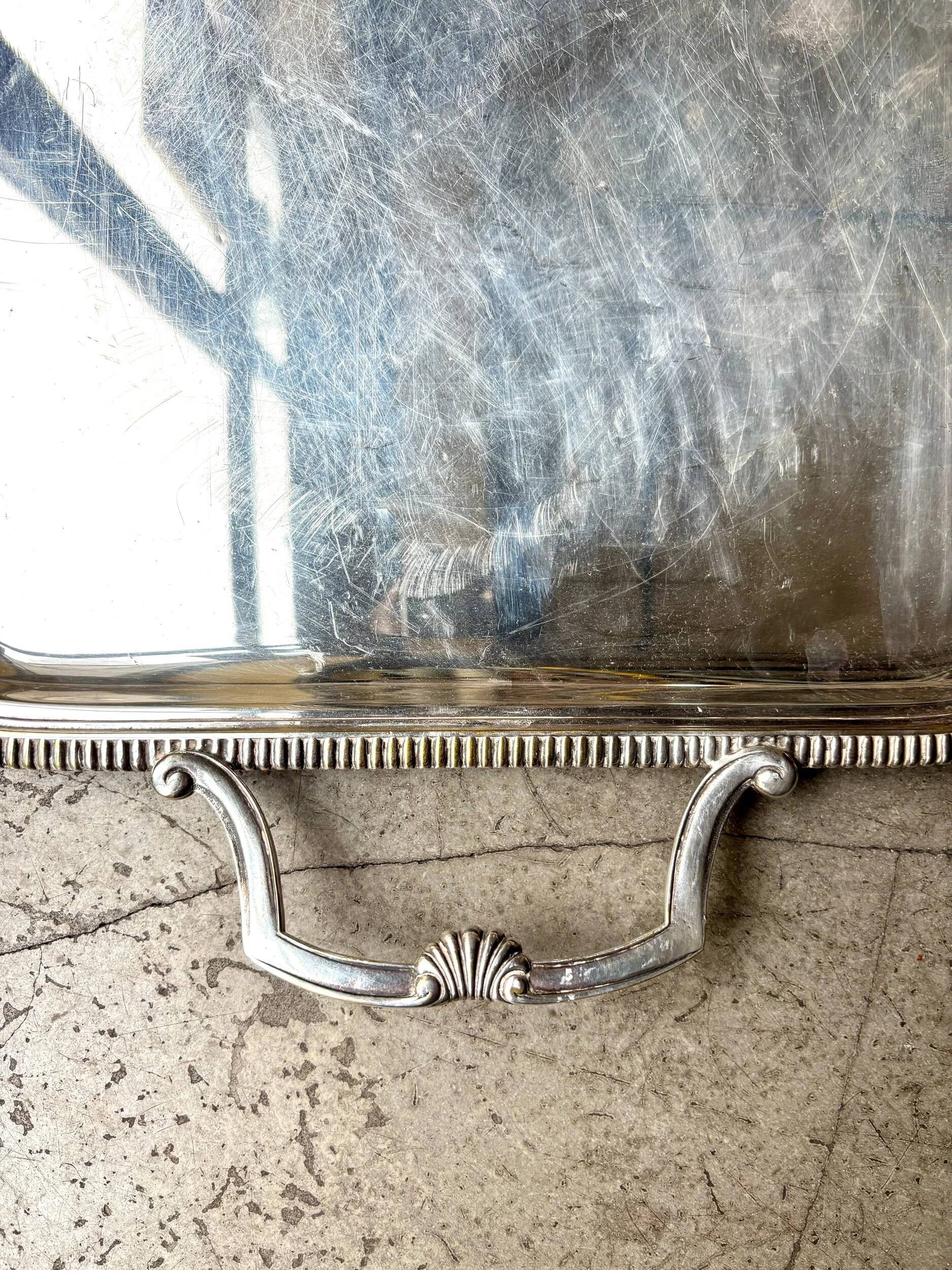 Rectangular silver-plated metal tray with a striated and shell design