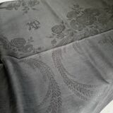 Old damask tablecloth with monogram