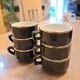 Green and gold coffee cups and sub-cups