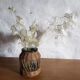 Glass and rattan vase