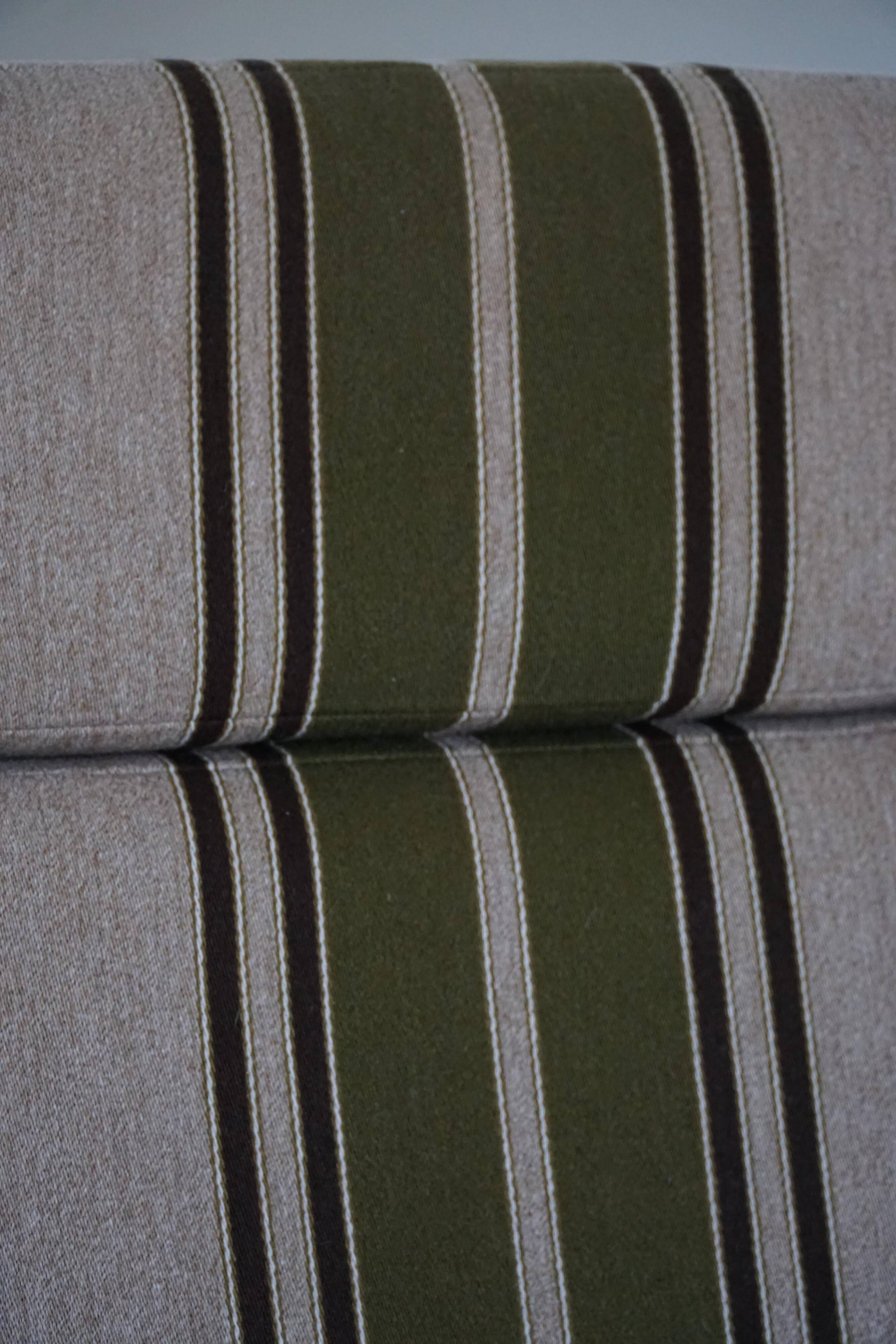 Pair of high-back lounge chairs in modern Danish style in the manner of Henning Kjærnulf, 1960s.