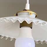 Old lampshade in white opaline glass with a wavy edge.