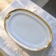 Large oval dish with gold trim in Limoges porcelain by Peconnet.