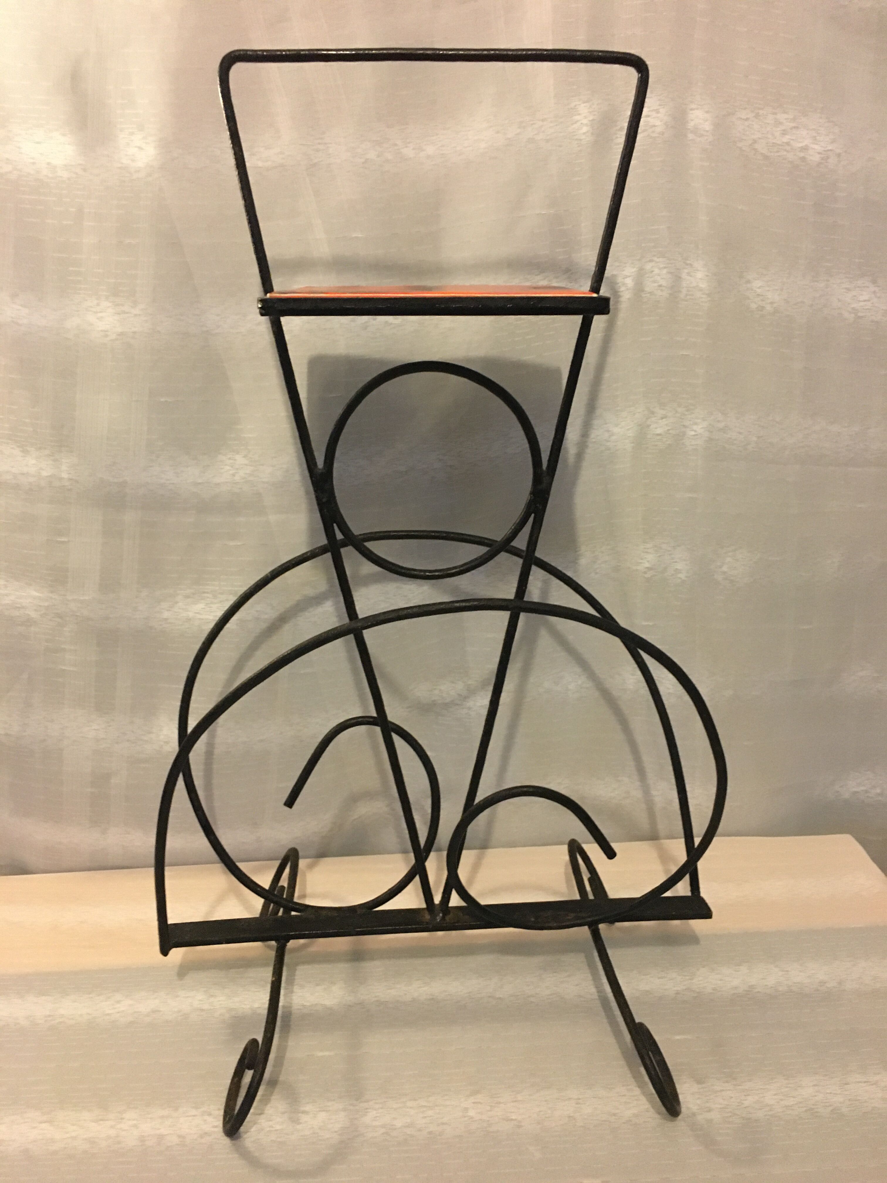 Wrought iron newspaper holder