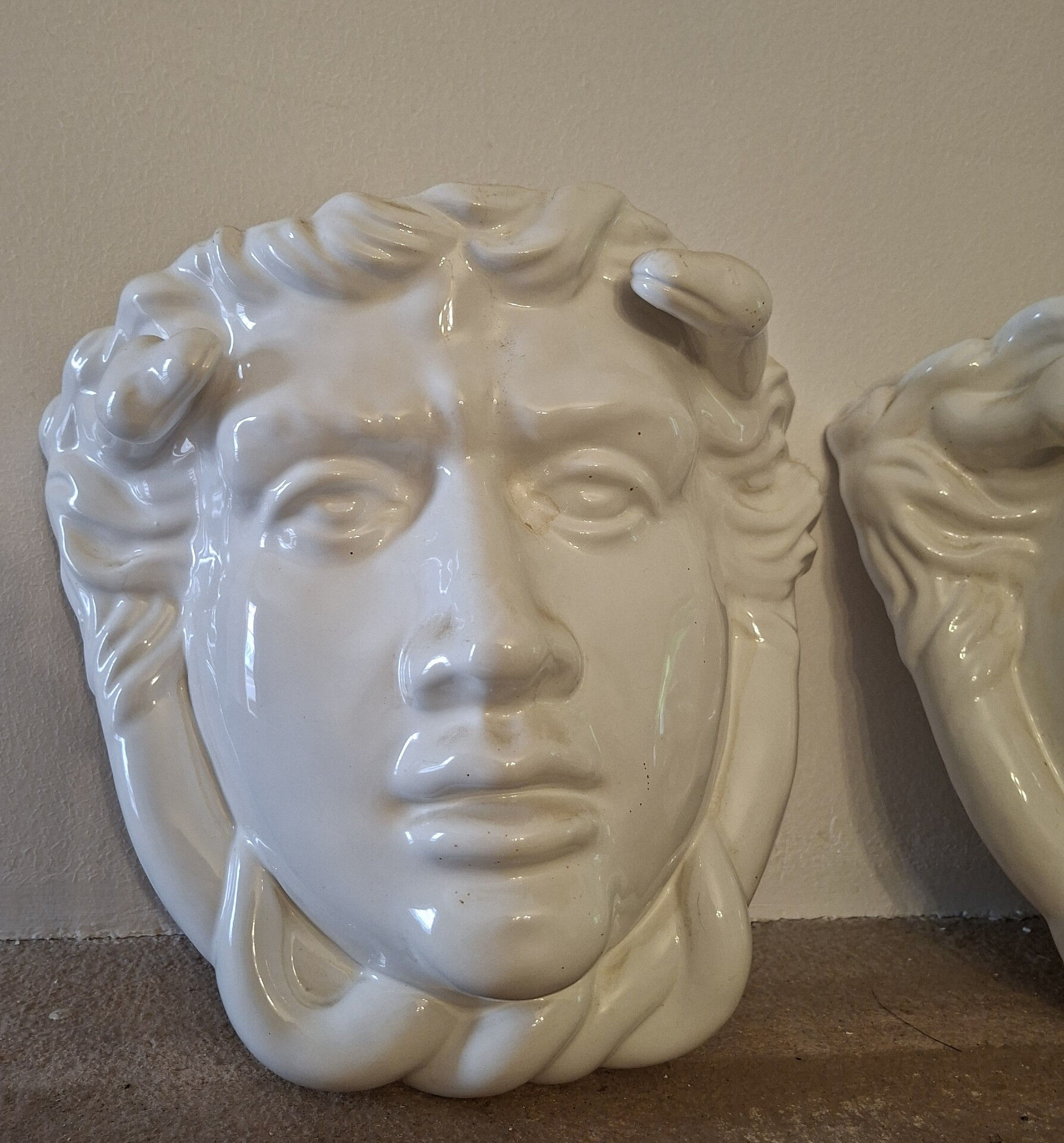 Pair of white glazed ceramic wall planters