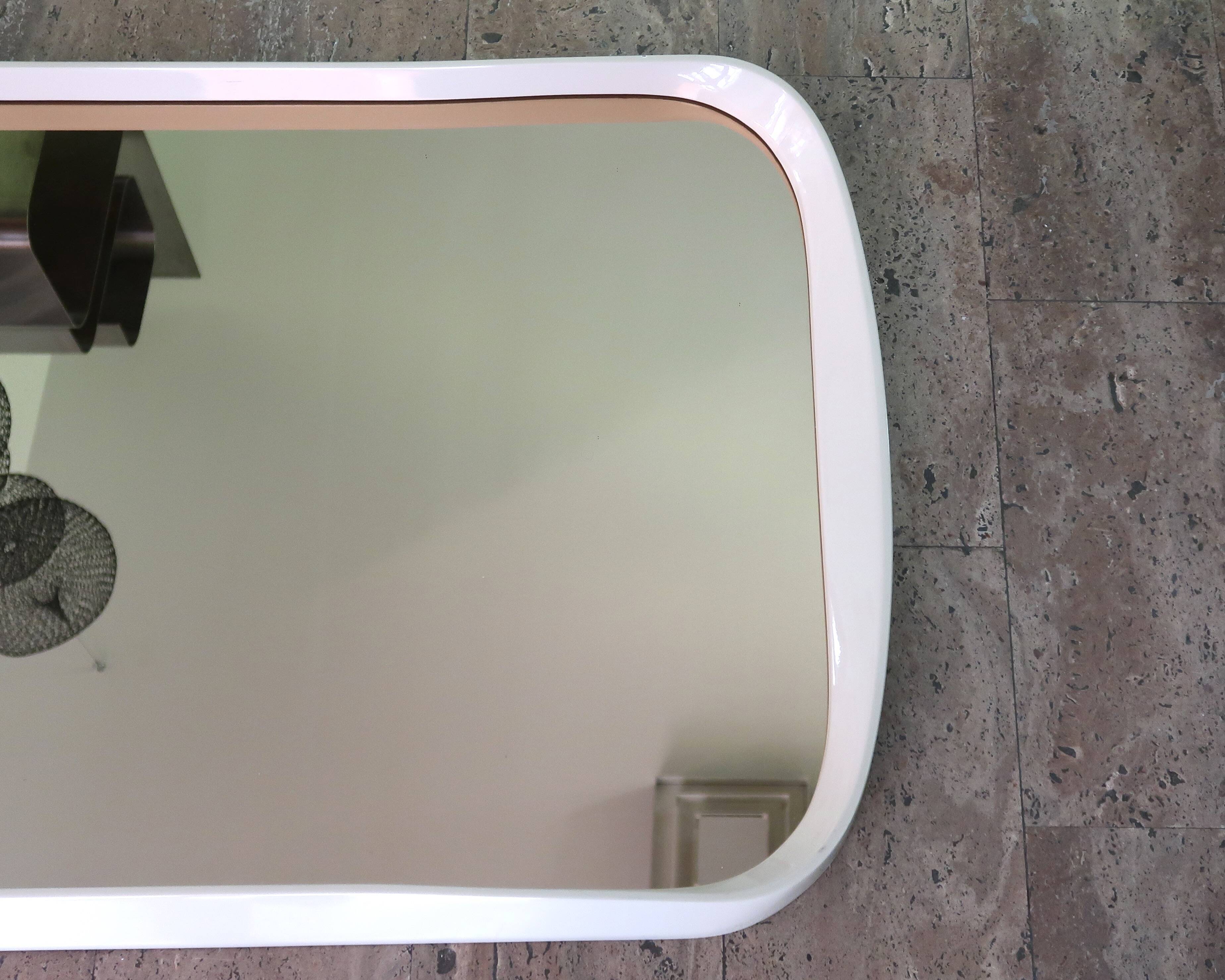 Rectangular mirror, horizontal or vertical, in white lacquered wood, 1970s.
