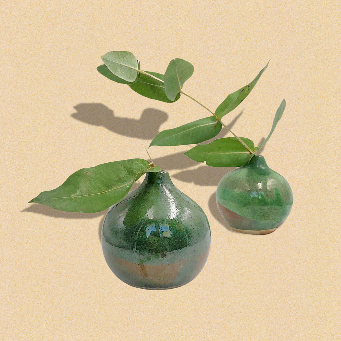 Two handcrafted enamelled ceramic vases