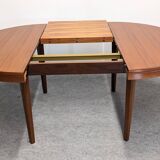 Scandinavian round extendable teak table, 60s-70s