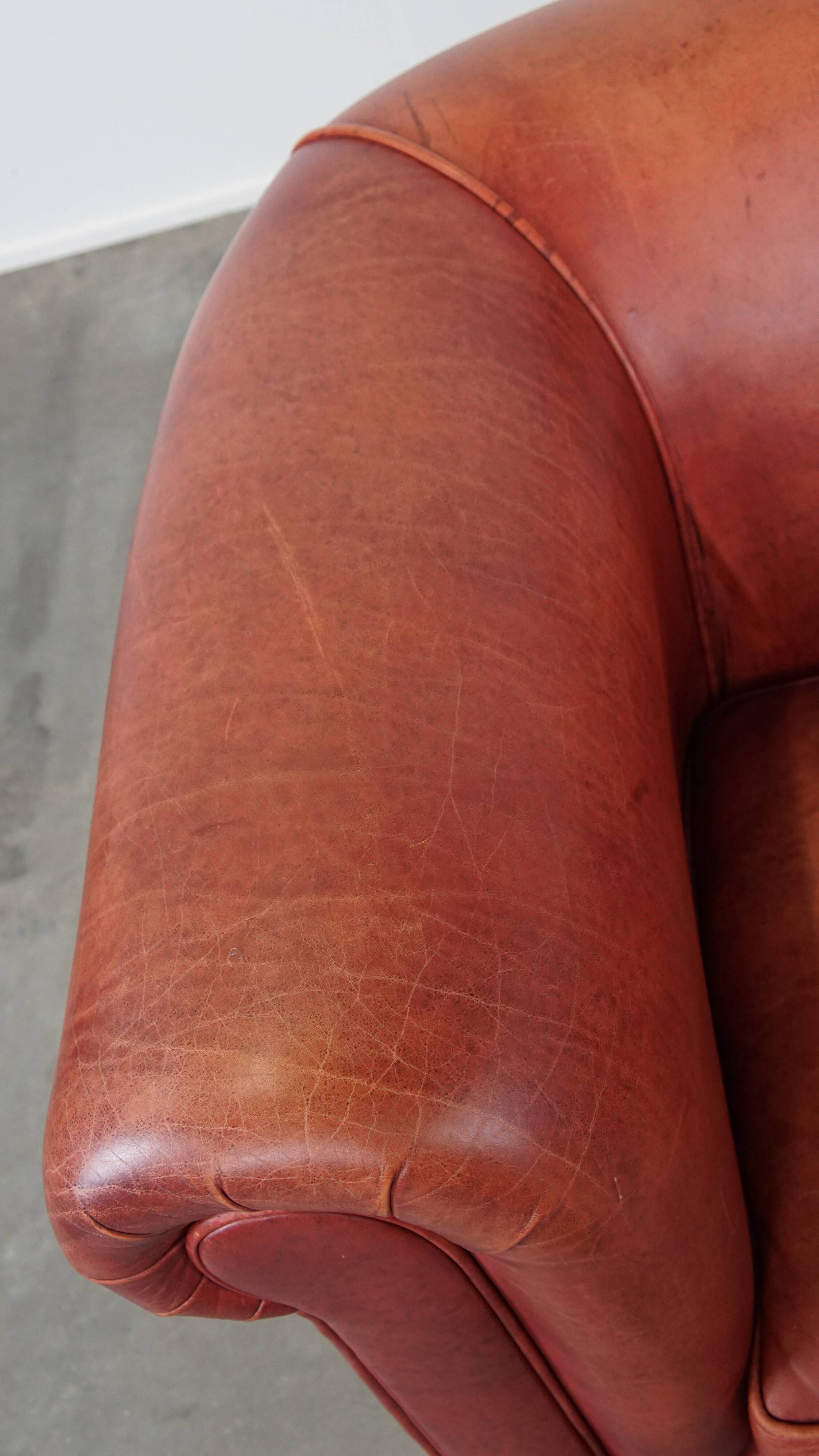 English Chesterfield club chair in light red cowhide leather