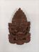 Asian decorative mask in carved wood