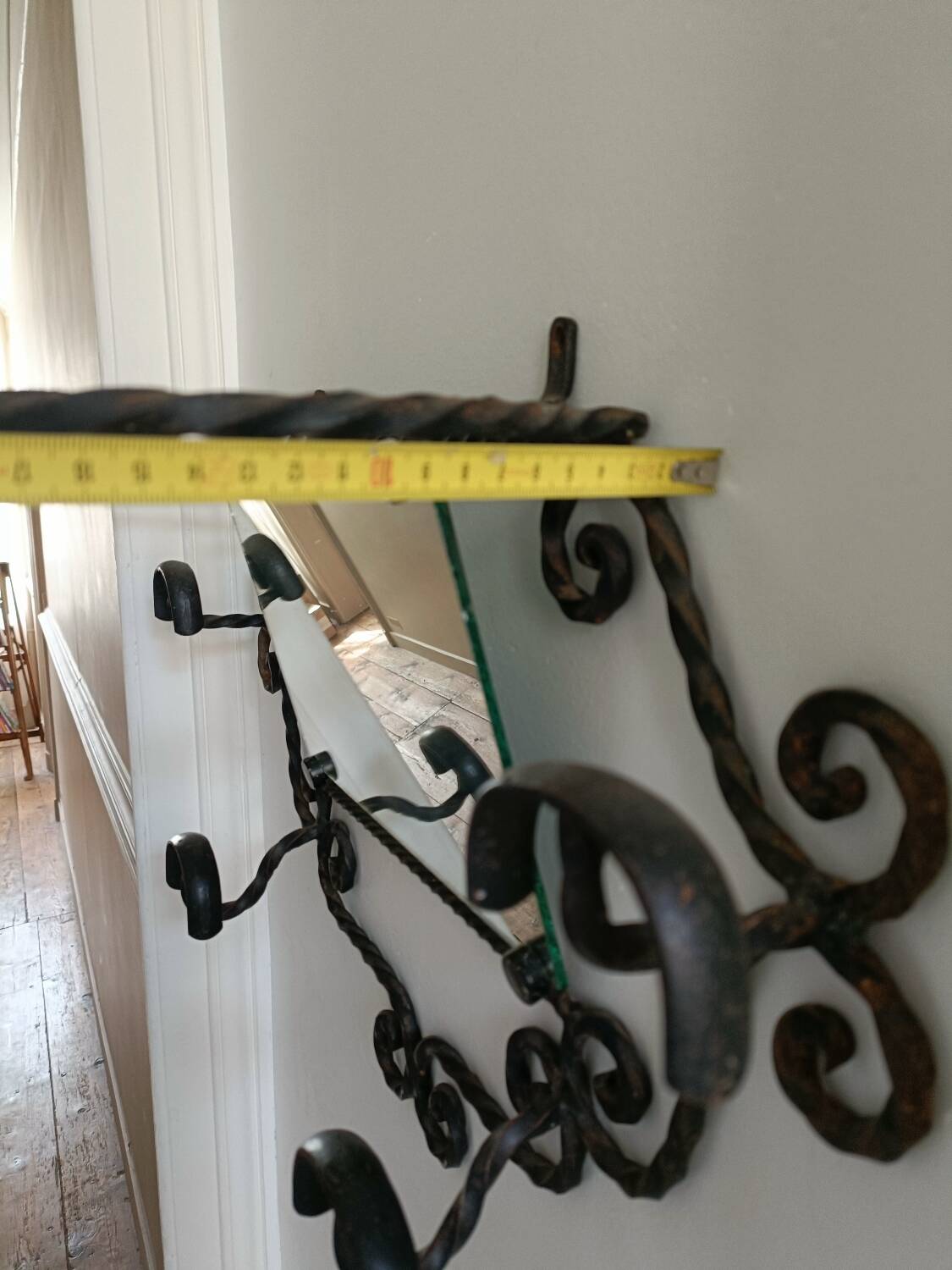 Twisted wrought iron wall-mounted coat rack