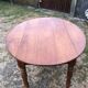 Louis Philippe oval drop-leaf table in solid cherry wood with 2 drawers.