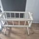 white wooden rocking cradle for baby or doll