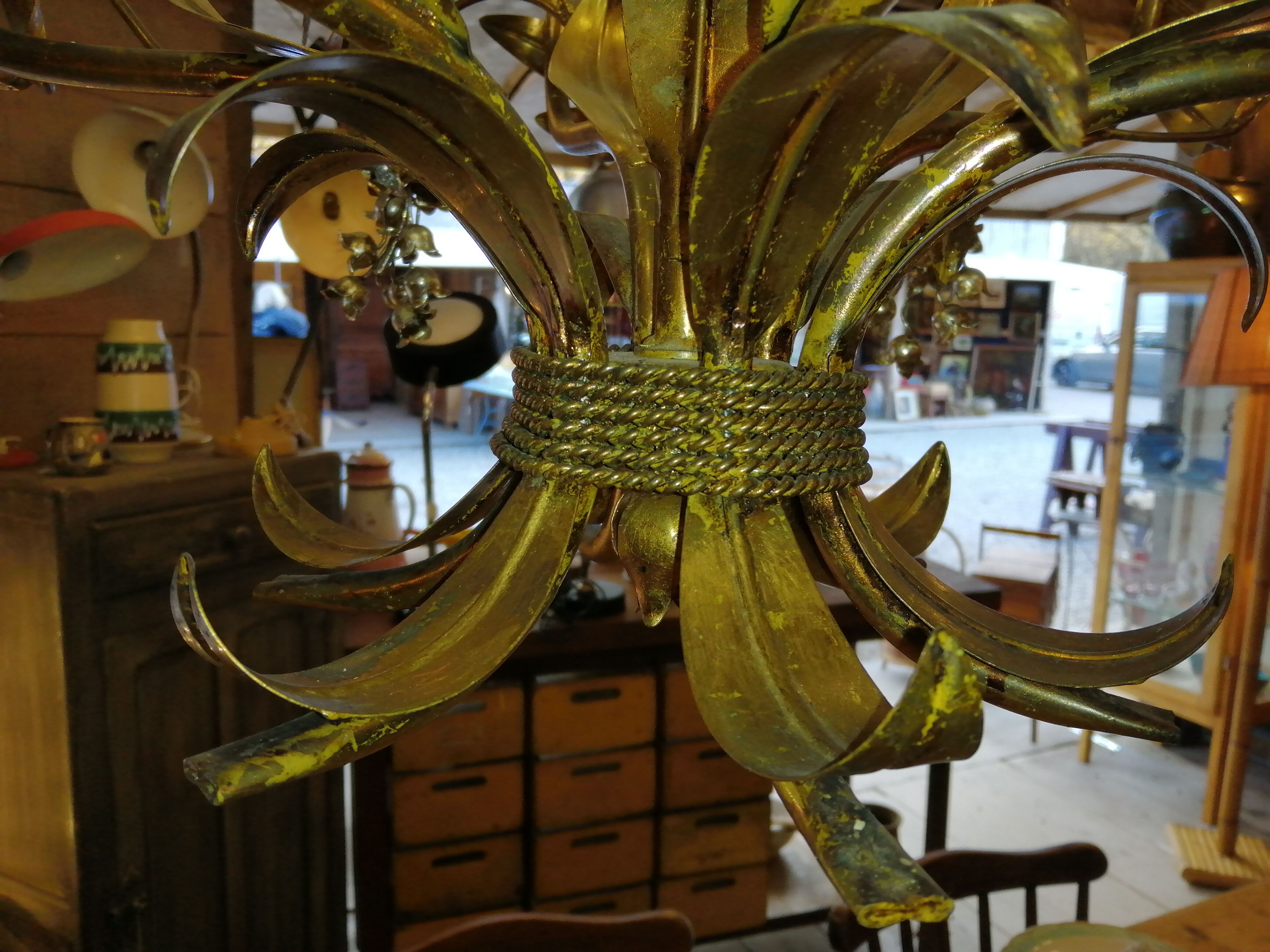 Gilded brass chandelier and silver lily of the valley bells
