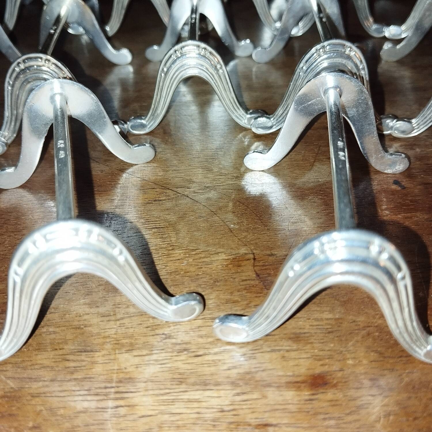 12 Art Deco silver-plated knife rests