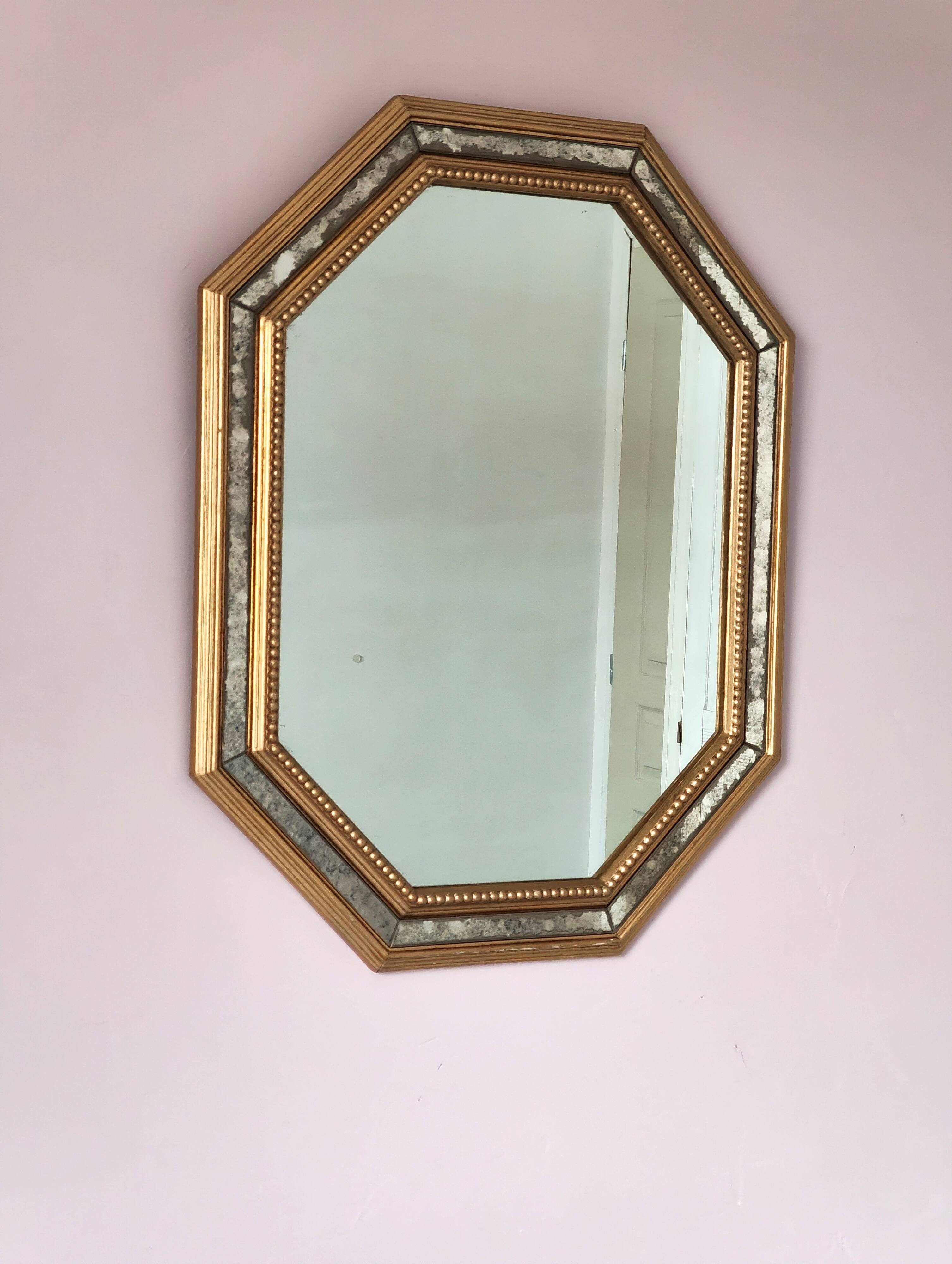 Antique mirror with gilded wooden frame.