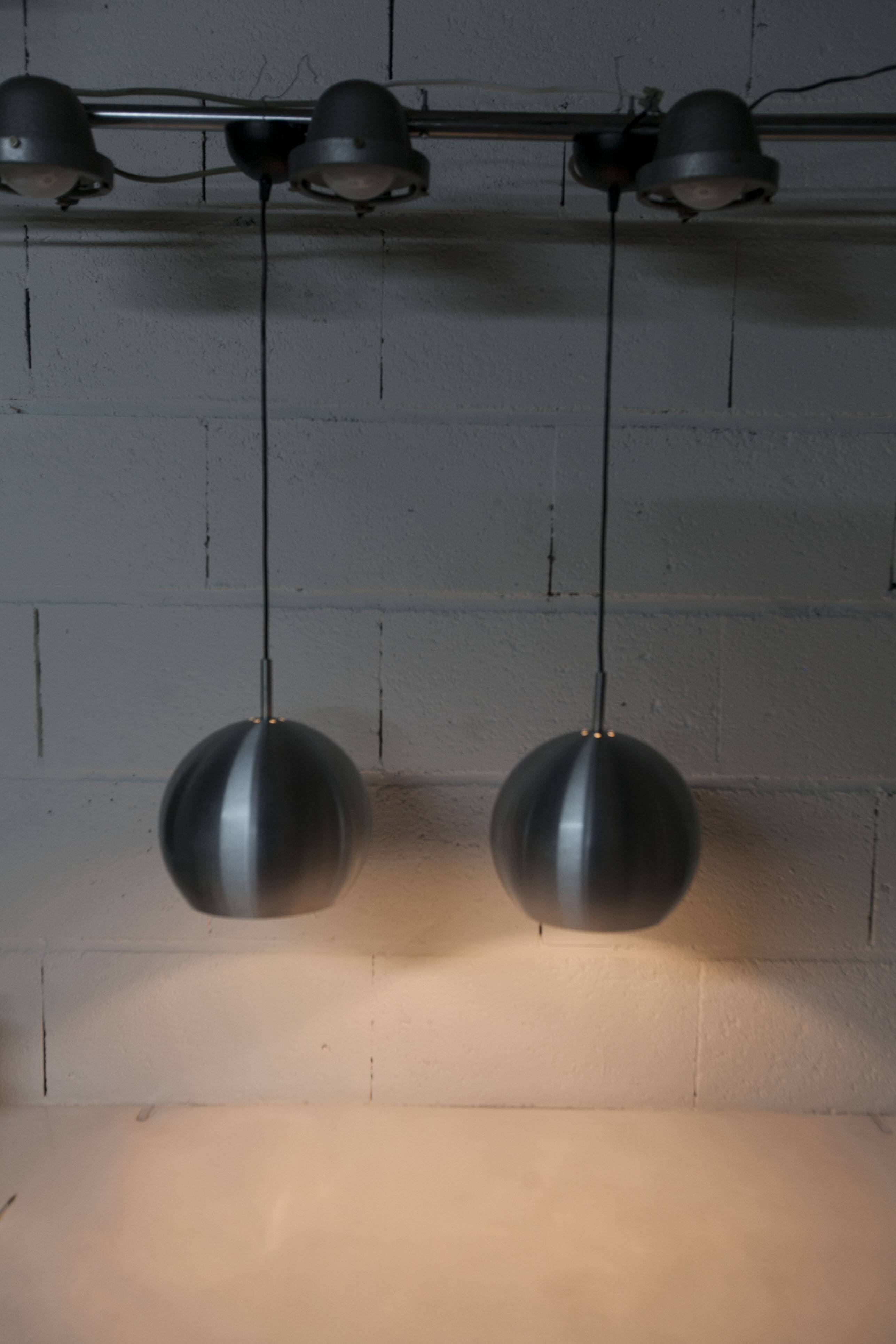 Pair of functional 70's aluminum ball pendants
