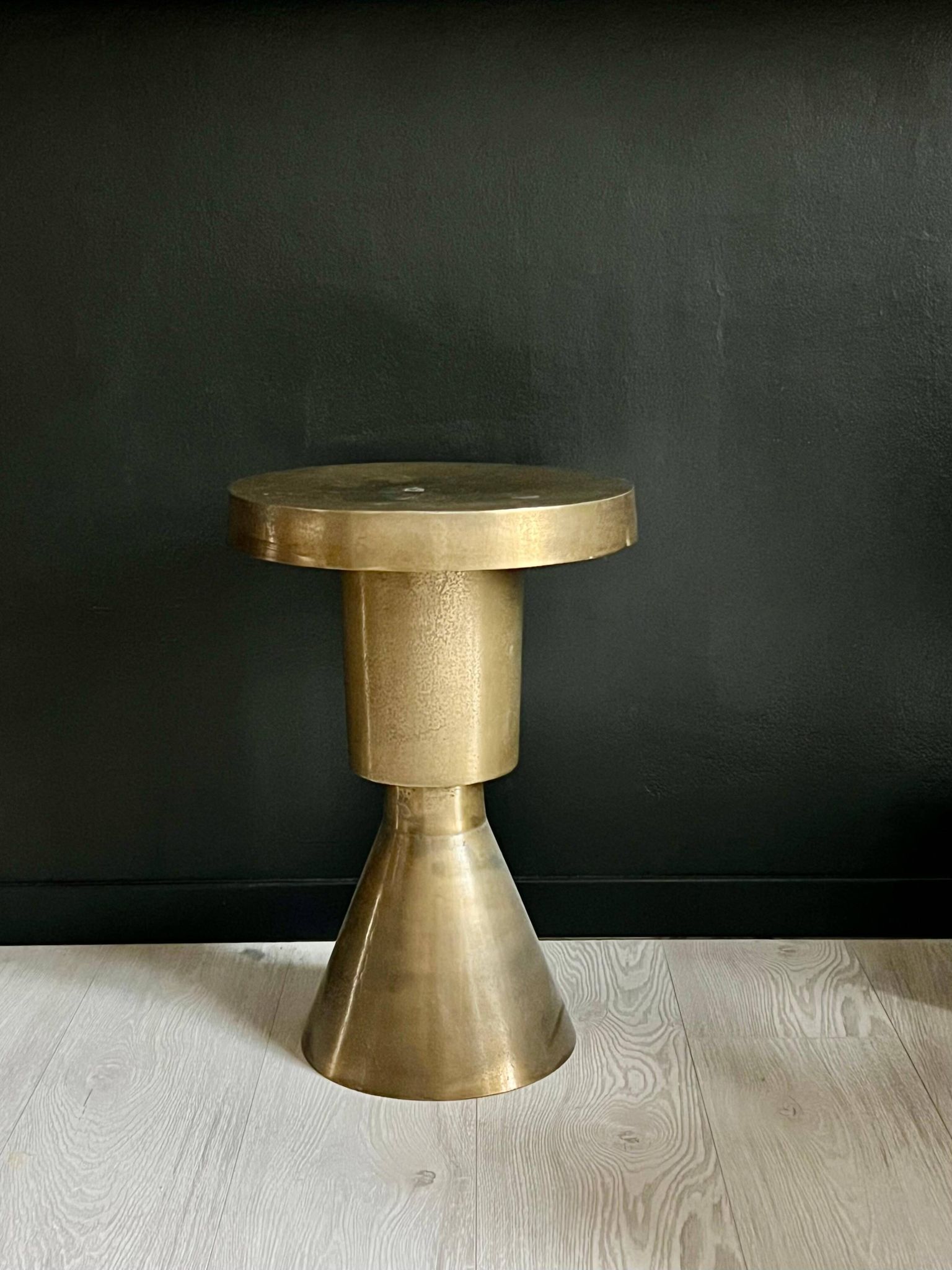 Sculptural metal side table, contemporary brassy side for modern interiors