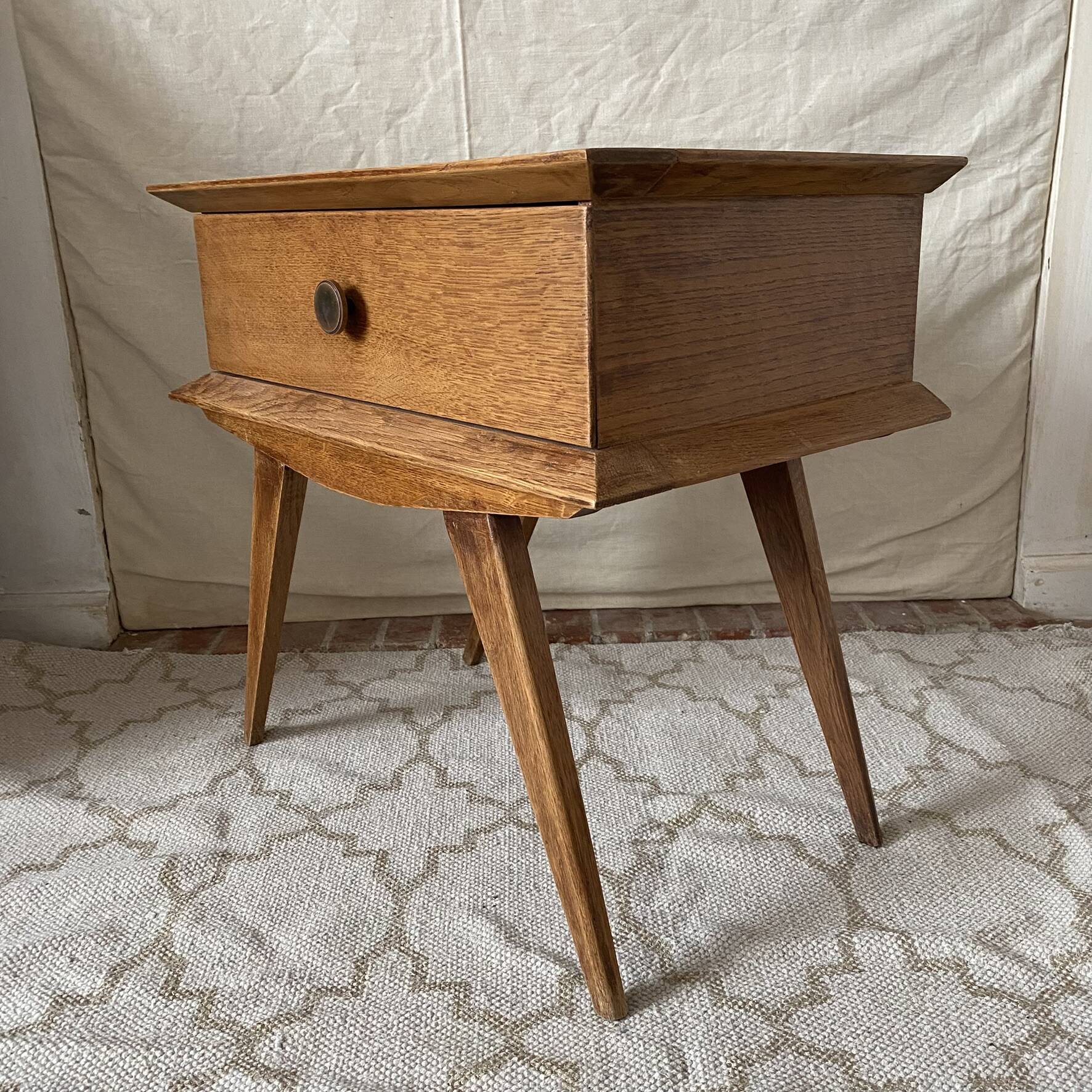 Scandinavian style bedside table with tapered legs from the 1960s.