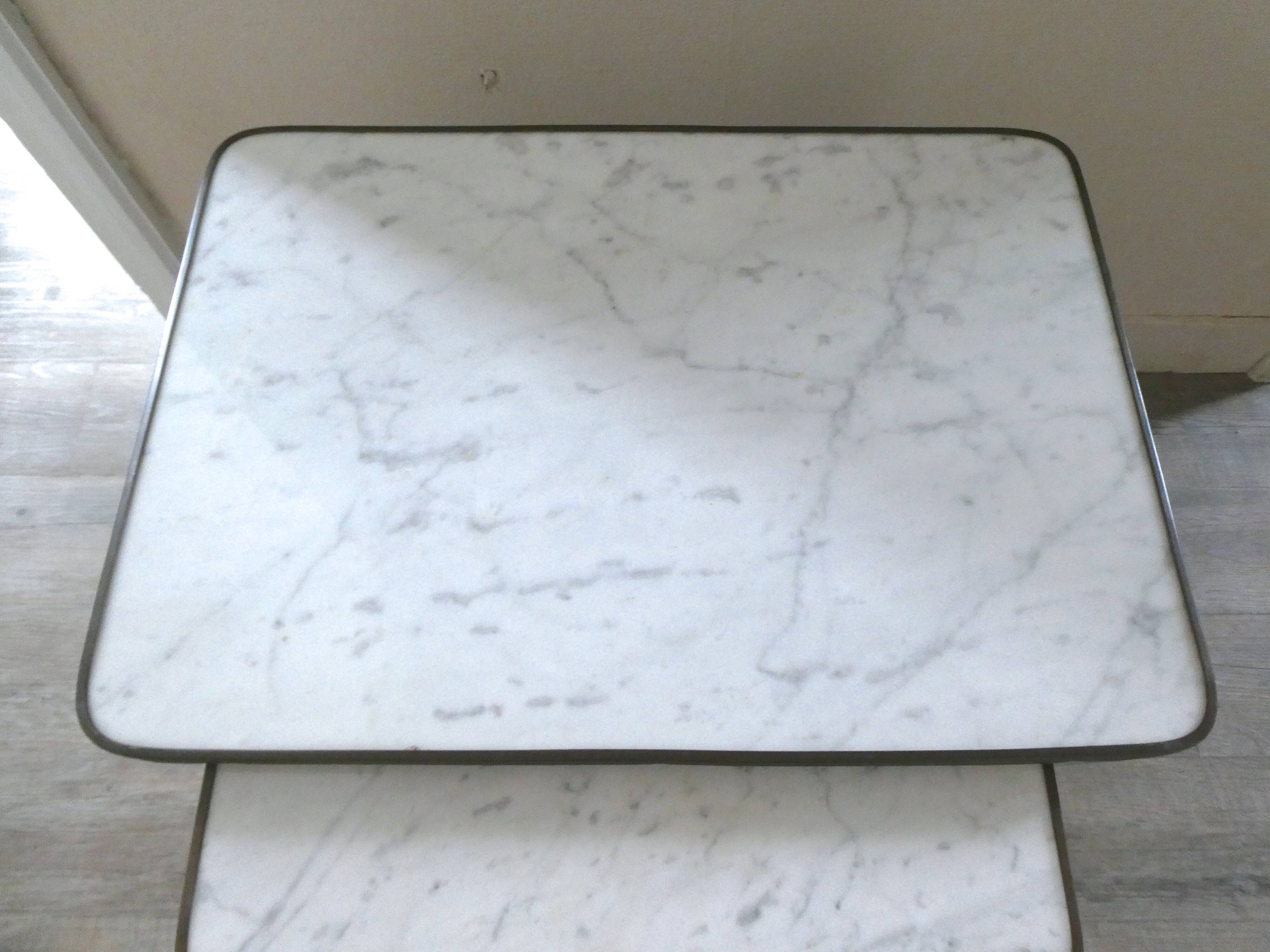 Nesting tables in dark wood and white marble